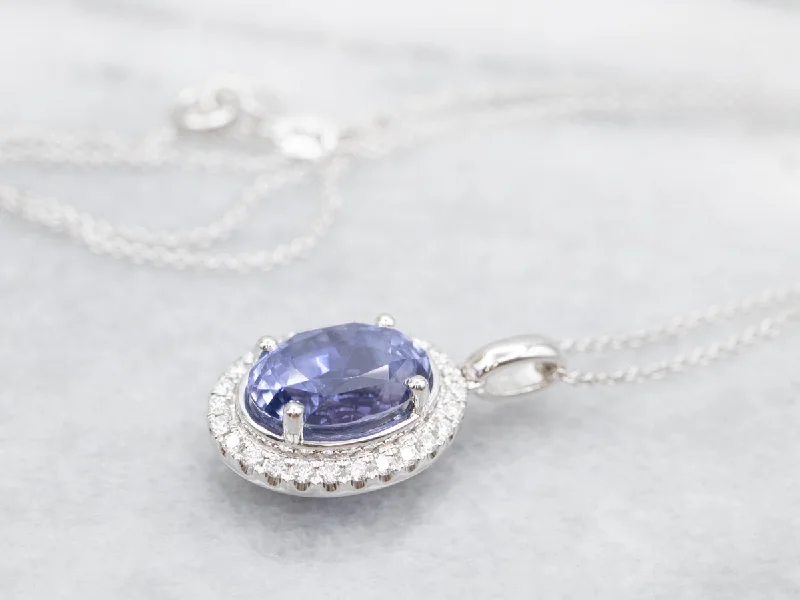 Trendy statement necklaces for girls-Modern Sapphire Halo Pendant Necklace